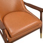 Sillón decorativo de polipiel marrón con patas cónicas